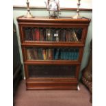 Pair of inlaid mahogany sectional bookcases with leaded glass. (114 cm H x 87 cm W x 27 cm D).