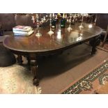 Edwardian mahogany dining room table on cabriole legs with two extra leaves.