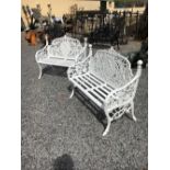 Pair of decorative cast iron white garden benches.