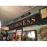 Carved wooden GUINNESS advertising sign.