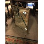 Art Nouveau copper and brass firescreen with decorative mirrored plate.