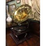 Gramophone with brass horn.