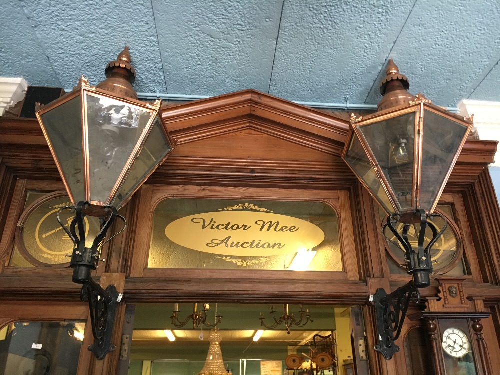 Four copper and metal lanterns with brackets.