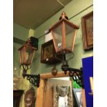 Pair of copper head wall lanterns with brackets.