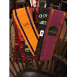 Collection of Orange and Black sashes.