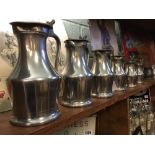 Set of six graduating pewter tankards.