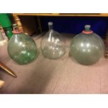 Three green glass carbide jars.