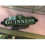 Cast iron GUINNESS advertisement.