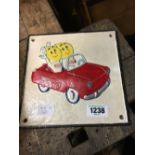 Cast iron ESSO HAPPY MOTORING advertising plaque.