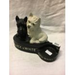 Pair of BLACK and WHITE WHISKEY ruberoid advertising dogs.