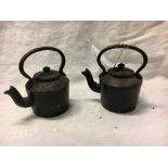 The small cast iron kettles.