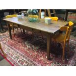 19th. C. elm kitchen table with two drawers in the frieze raised on tapered legs.