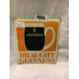 DRAUGHT GUINNESS celluloid showcard advertisement.