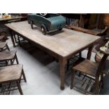 19th C. Elm kitchen table with single drawer in frieze and raised on turned legs.