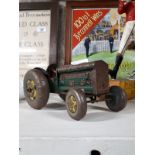 Tin plate toy tractor.