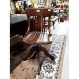 Early 20th. C. oak swivel office chair.