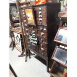 Early 20th C. Oak sectional drawers on stand.