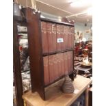 Early 20th C. wall mounted book shelves including a collection of 16 Dickens novels.