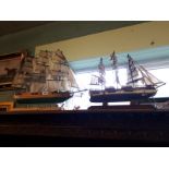 Two wooden models of ships.