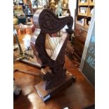 Carved wooden Celtic harp.