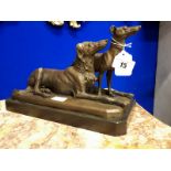 Bronze figure of seated dog with another standing beside.