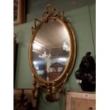 Regency oval gilt mirror. (113 cm H x 57 cm W).
