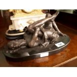 Bronze model of a Reclining Lady on marble base.