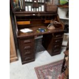 Early 20th C. oak roll top pedestal desk.