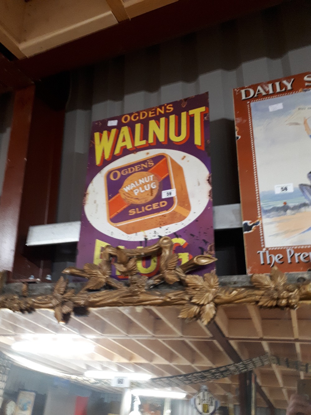 Ogden's Walnut Plug tin plate advertising sign.