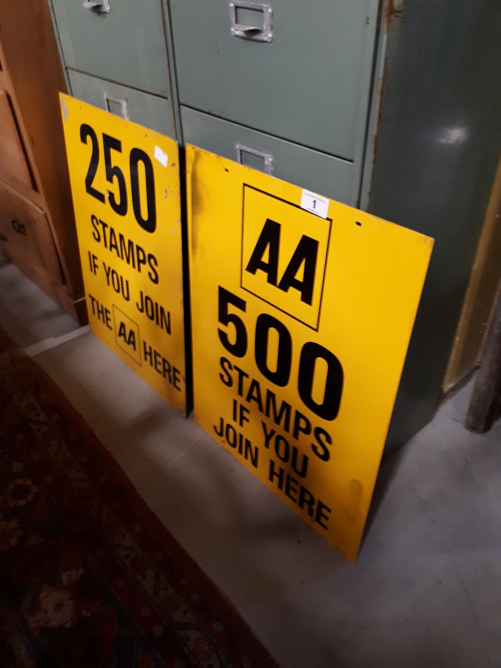 Two metal AA road signs.