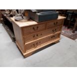 Stripped pine chest of draws two over two.