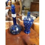 Two blue glass vases.