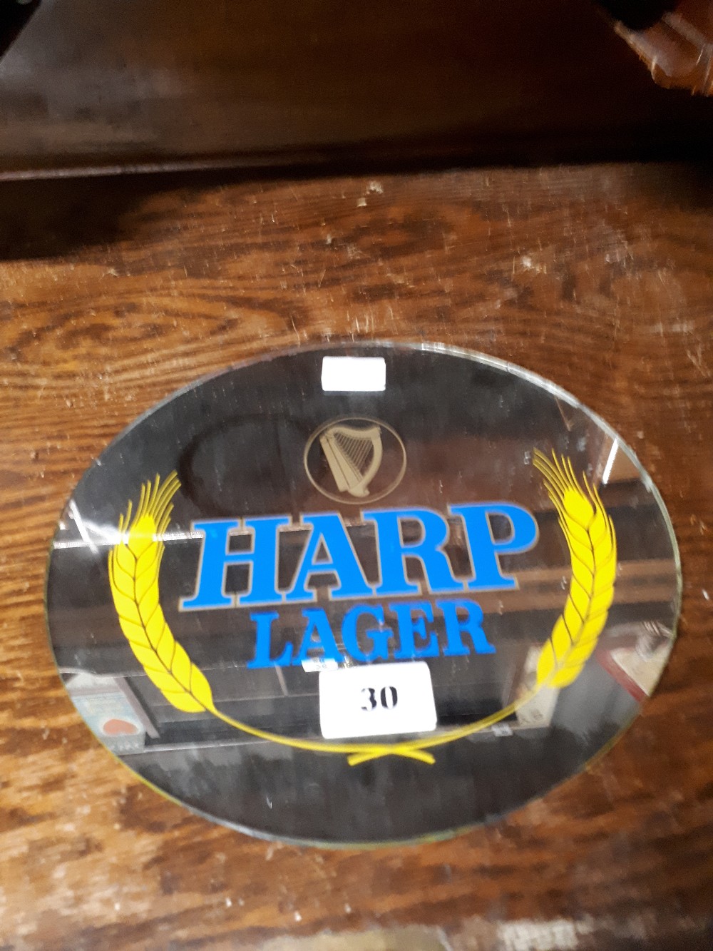 Harp lager advertising mirror.