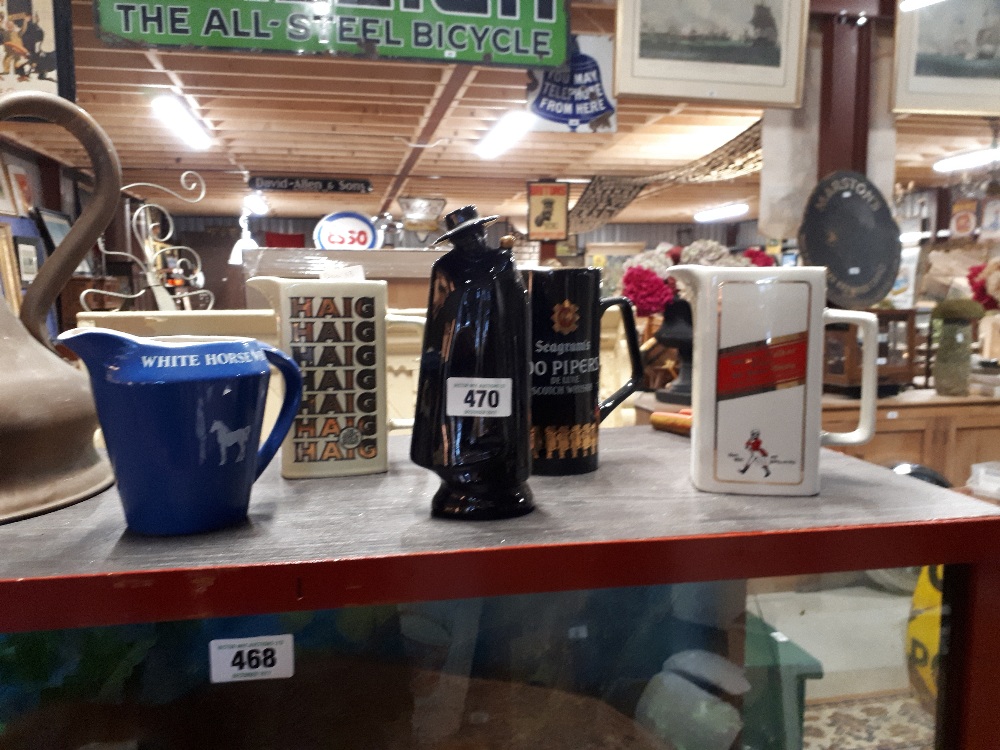 Selection of five whiskey jugs.