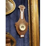 Edwardian carved oak barometer.