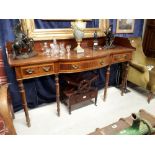 Georgian mahogany serving table raised on turned legs.