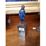 Cold painted bronze model of a boy on a marble base.