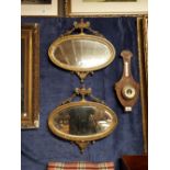 Pair early 19th C. gilt wood oval mirror in the Adams style.