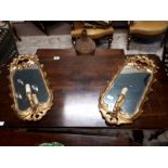 Pair of Victorian carved giltwood wall mirrors with ensconces.