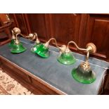 Two brass wall lights with green glass shades and two twin brass wall lights with green glass