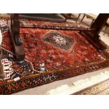 Persian rug. { 220cm L X 150cm W }.