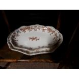 Two brown and white ceramic platters.