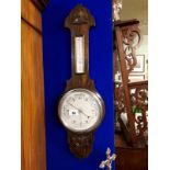 Victorian carved oak barometer.