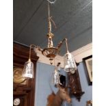 Early 20th. C. brass hanging light with three glass shades.