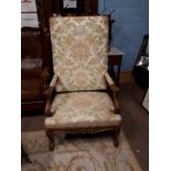Carved walnut throne chair raised on cabriole legs.