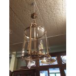 Brass and glass hall lantern of cylinder form.