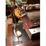 Early 20th C. brass desk lamp with ruby glass shade.