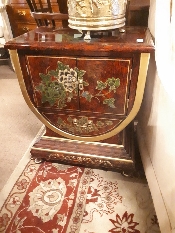 Oriental side cabinet with two doors.