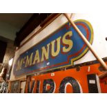 MC MANUS wooden shop sign.