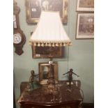 Gilded brass table lamp in the Rococo style with original shade.